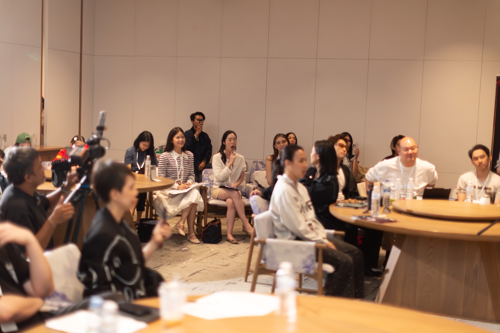 Participants and production coverage inside the workshop room